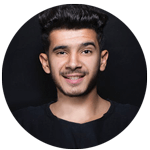 Smiling young man posting a comment about his great shopping experience.